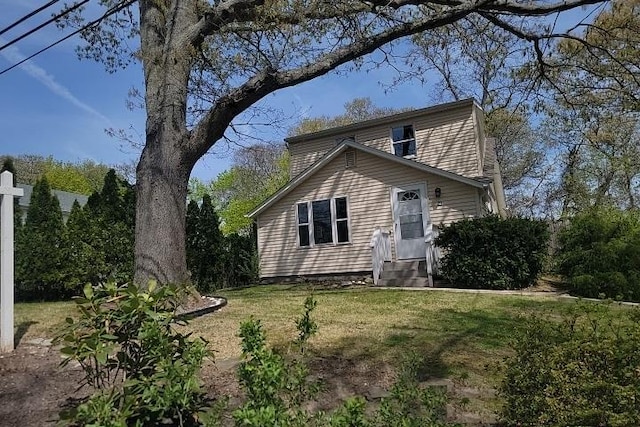 21 Patchogue Dr, Rocky Point, NY 11778 - view of front of home featuring a front yard and entry steps