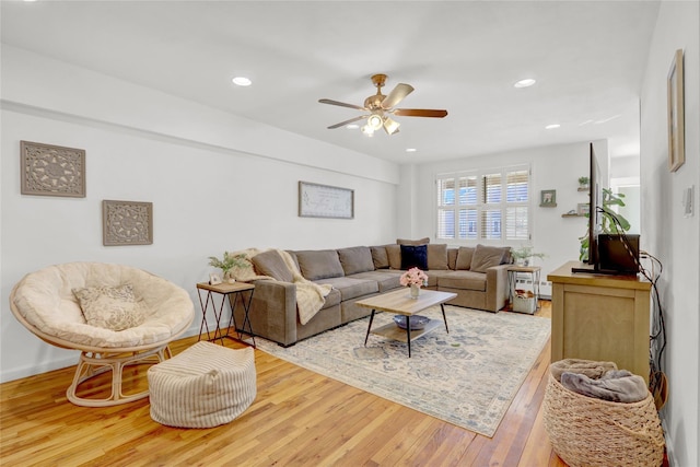 living room with recessed lighting, baseboards, ceiling fan, and wood finished floors