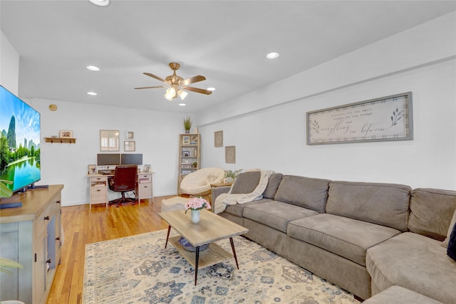 living room with recessed lighting, a ceiling fan, and light wood-style floors