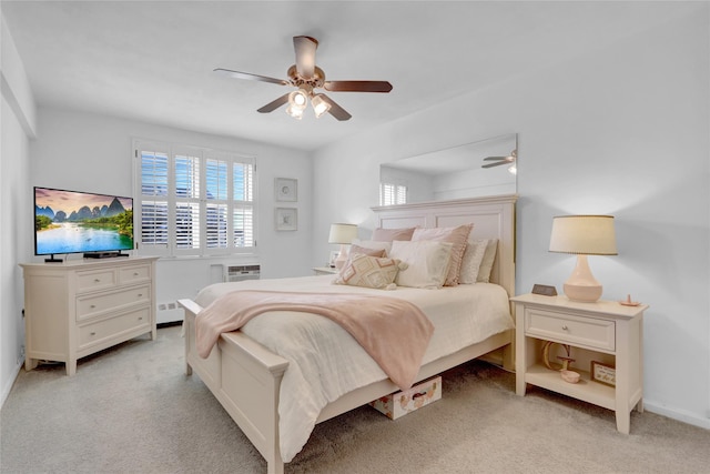 bedroom featuring a wall mounted air conditioner, light colored carpet, and ceiling fan