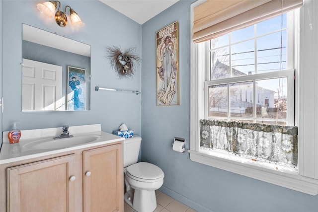 bathroom with vanity, tile patterned floors, and toilet