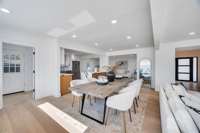 dining area featuring a wealth of natural light, baseboards, recessed lighting, and light wood finished floors