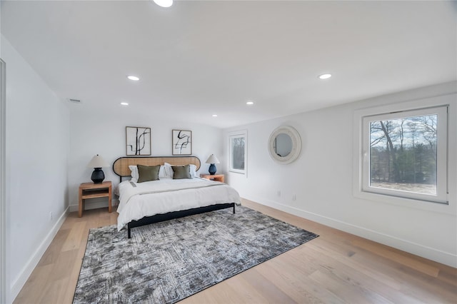 bedroom featuring visible vents, recessed lighting, light wood-style floors, and baseboards