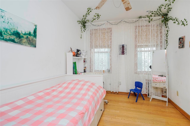 bedroom with wood finished floors