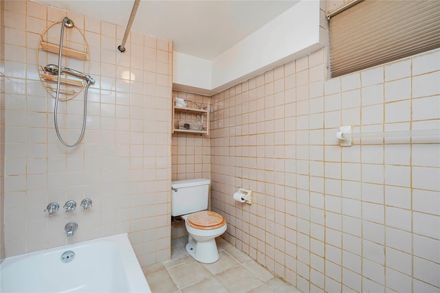 full bath with tile patterned flooring, tile walls, toilet, and shower / washtub combination