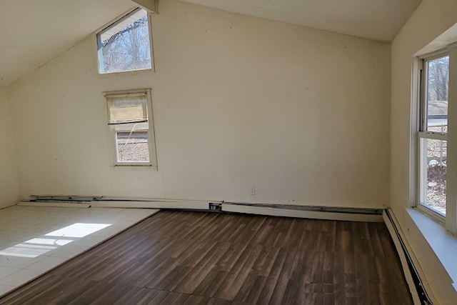 bonus room featuring a baseboard heating unit, lofted ceiling, and wood finished floors