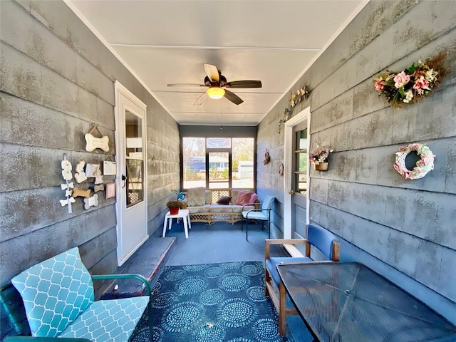 sunroom / solarium with ceiling fan