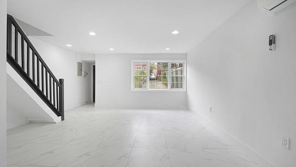 interior space featuring recessed lighting, marble finish floor, stairway, and a wall mounted AC