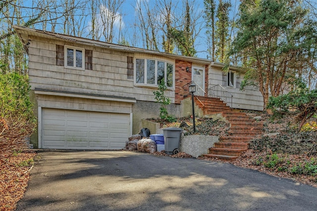 view of front of property featuring an attached garage and driveway