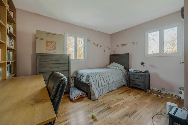 bedroom with light wood finished floors