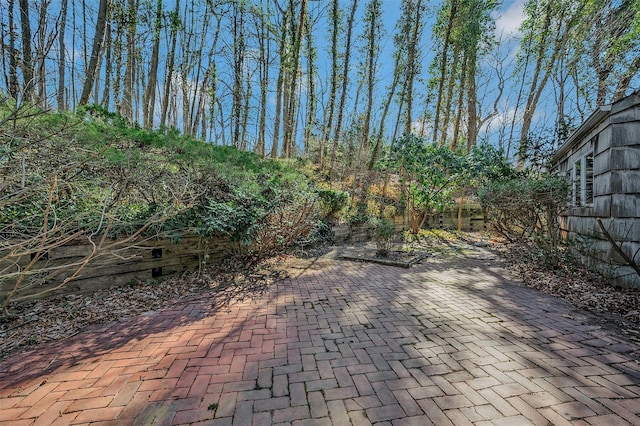 view of patio / terrace featuring fence