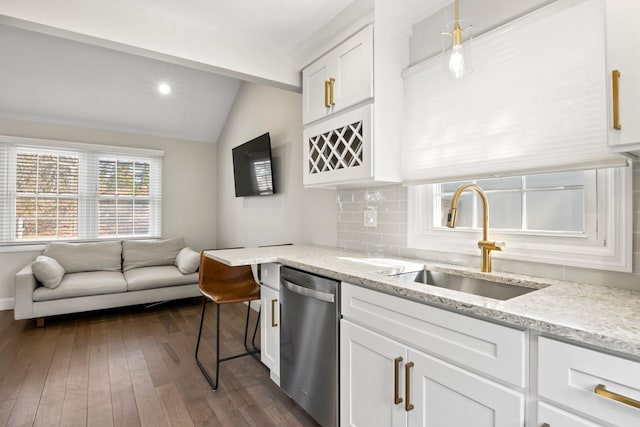 kitchen with a sink, decorative backsplash, dishwasher, dark wood-style flooring, and vaulted ceiling