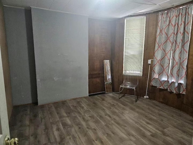 spare room featuring wood finished floors