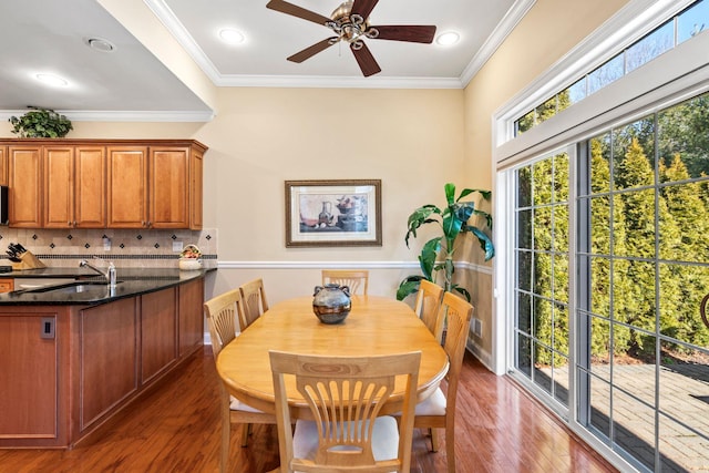 dining room featuring recessed lighting, a ceiling fan, wood finished floors, and crown molding