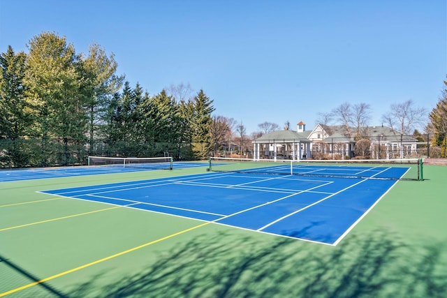 view of sport court with fence