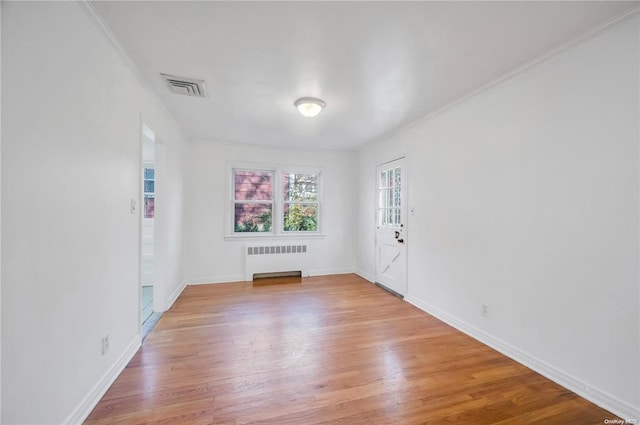 21 Ravine Rd, Great Neck, NY 11023 - unfurnished room with visible vents, light wood-type flooring, radiator heating unit, and baseboards