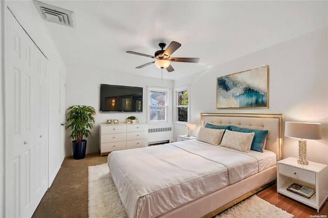 21 Ravine Rd, Great Neck, NY 11023 - bedroom featuring a closet, visible vents, radiator, and ceiling fan
