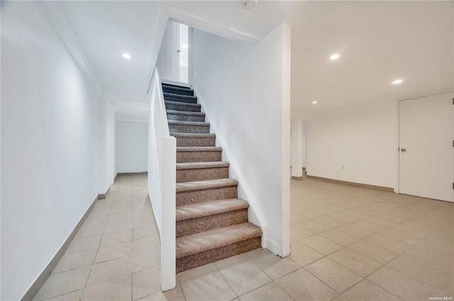 21 Ravine Rd, Great Neck, NY 11023 - stairway with tile patterned floors, recessed lighting, and baseboards