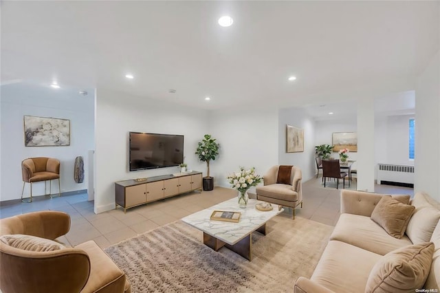 21 Ravine Rd, Great Neck, NY 11023 - living area featuring light tile patterned floors, recessed lighting, and radiator