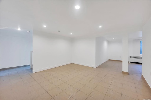21 Ravine Rd, Great Neck, NY 11023 - basement with light tile patterned flooring, recessed lighting, radiator, and baseboards