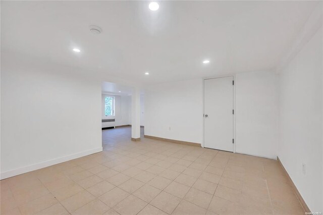 21 Ravine Rd, Great Neck, NY 11023 - spare room featuring recessed lighting, baseboards, and radiator