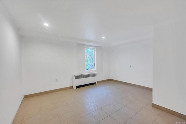 21 Ravine Rd, Great Neck, NY 11023 - spare room with radiator, recessed lighting, and baseboards