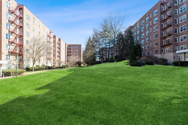 view of property's community with a lawn