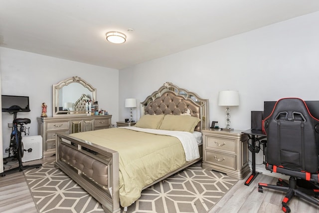 bedroom with light wood finished floors