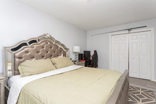 bedroom with a closet and wood finished floors