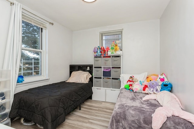 bedroom with light wood finished floors