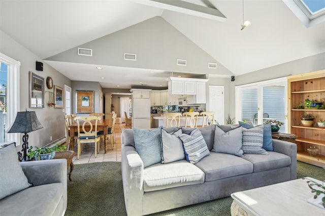 living area with visible vents and a skylight