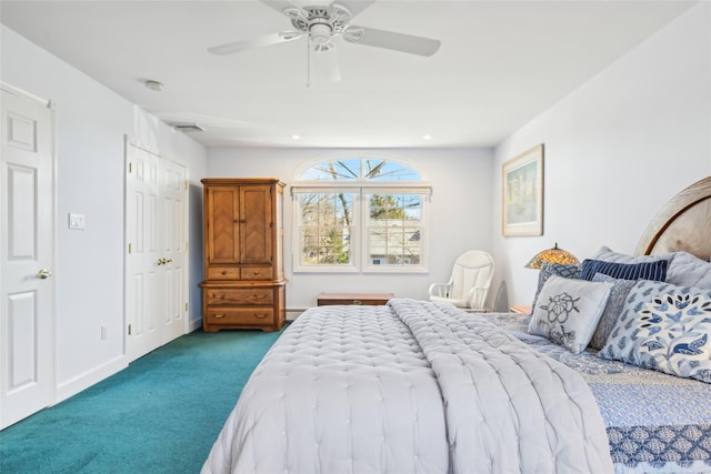 bedroom with baseboard heating, dark carpet, baseboards, and a ceiling fan