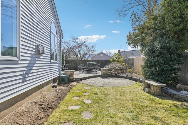 view of yard featuring a patio area and a fenced backyard