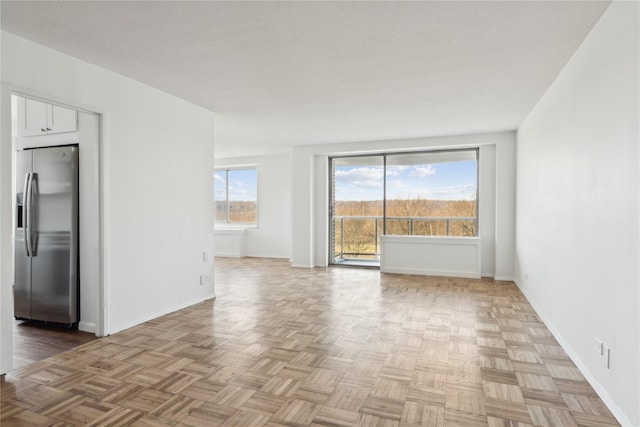 empty room with baseboards