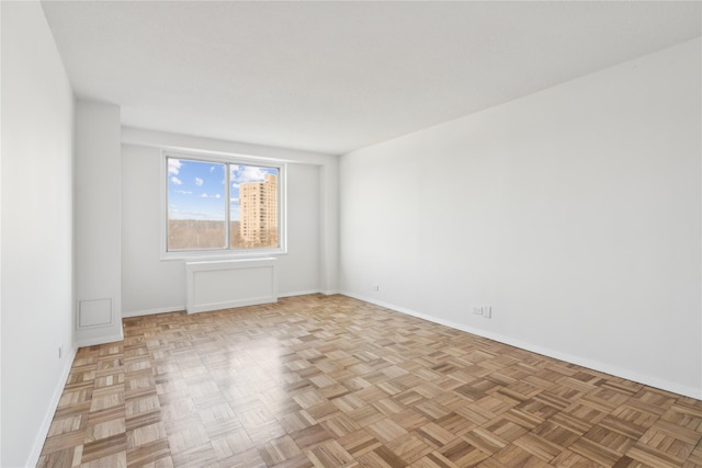 empty room with baseboards