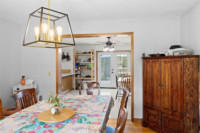 dining space featuring light wood-style flooring and ceiling fan