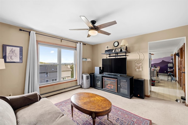 living area featuring carpet floors, a glass covered fireplace, baseboards, ceiling fan, and a baseboard radiator