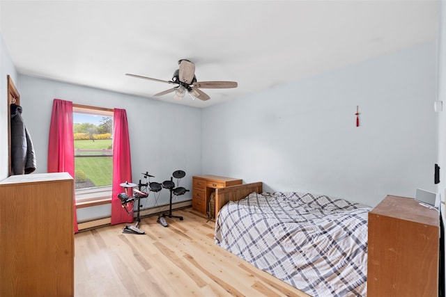 bedroom featuring ceiling fan and wood finished floors