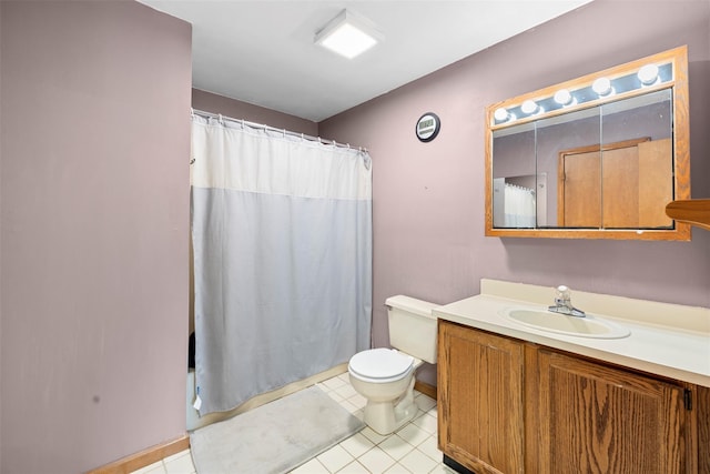 bathroom featuring tile patterned flooring, curtained shower, vanity, baseboards, and toilet