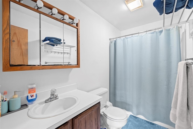 full bathroom with vanity, toilet, and a shower with shower curtain