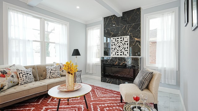 living room featuring a high end fireplace, beamed ceiling, marble finish floor, and baseboards