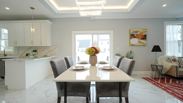 dining room featuring crown molding, baseboards, recessed lighting, marble finish floor, and a raised ceiling