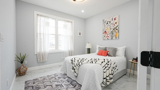 bedroom featuring recessed lighting, baseboards, and marble finish floor