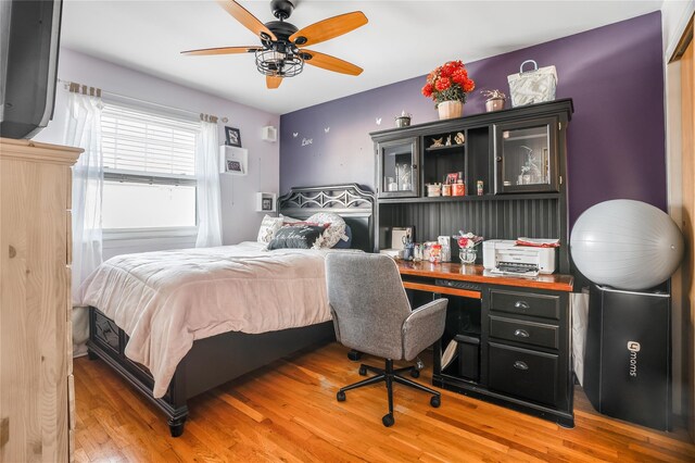 bedroom featuring ceiling fan and light wood-type flooring