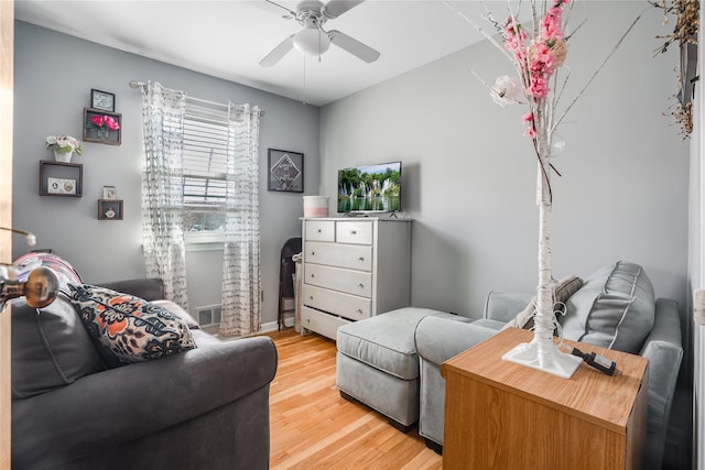bedroom with a ceiling fan, light wood-style floors, and visible vents