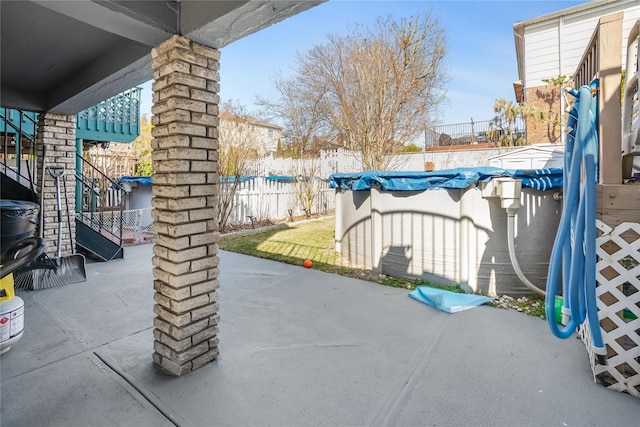 view of patio / terrace featuring a fenced backyard and a fenced in pool