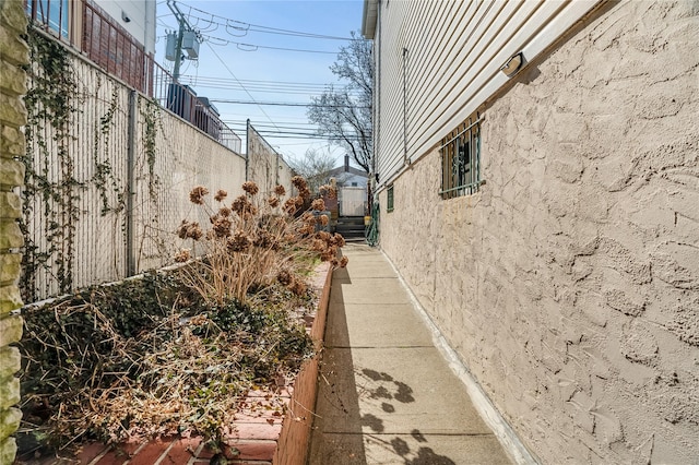 view of side of home with stucco siding