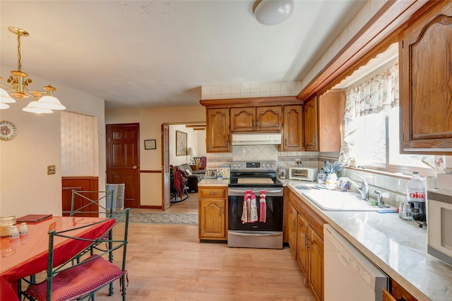 101 Grissom Way, Hauppauge, NY 11788 - kitchen featuring electric range, under cabinet range hood, light countertops, a sink, and white dishwasher