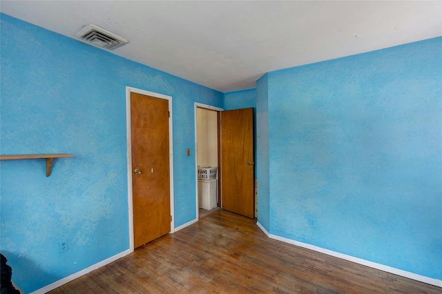 101 Grissom Way, Hauppauge, NY 11788 - unfurnished bedroom with visible vents, baseboards, and wood finished floors