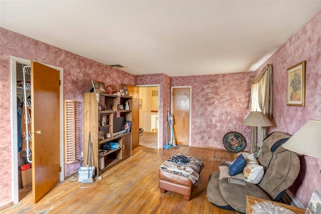 101 Grissom Way, Hauppauge, NY 11788 - living room featuring hardwood / wood-style floors, wallpapered walls, and visible vents